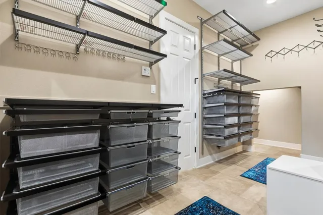 a spacious bathroom with a sink a mirror a bathtub and a shower