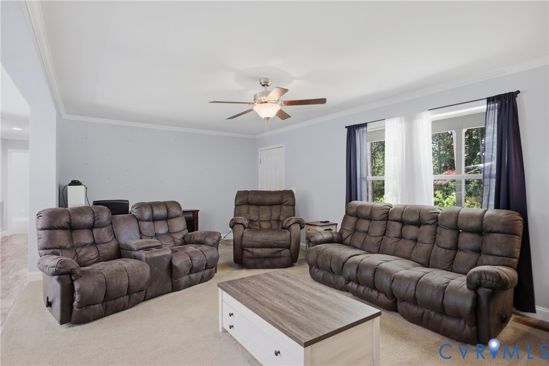 93 Faraway Road Saluda, VA 23149 - Photo 6 of 58 a living room with furniture and a large window