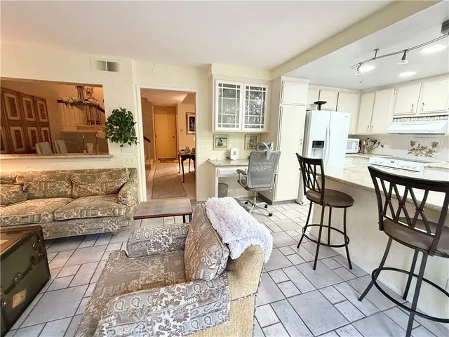 a living room with furniture and a table