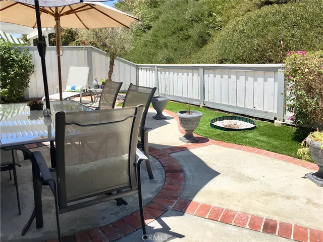 a swimming pool with outdoor seating yard and green space