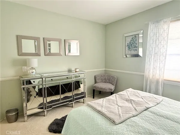 a bedroom with a bed and a cabinets