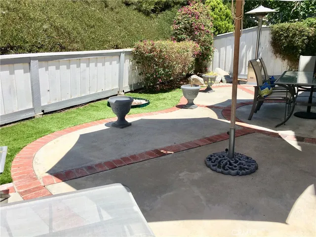 a view of a living room with furniture and a window