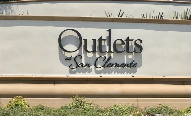 a view of a swimming pool and outdoor seating