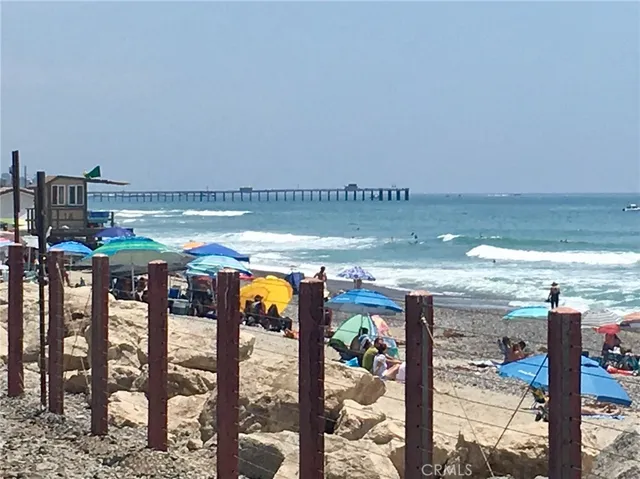 a view of a garden filled with furniture