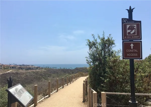 a view of a chairs and tables in the balcony