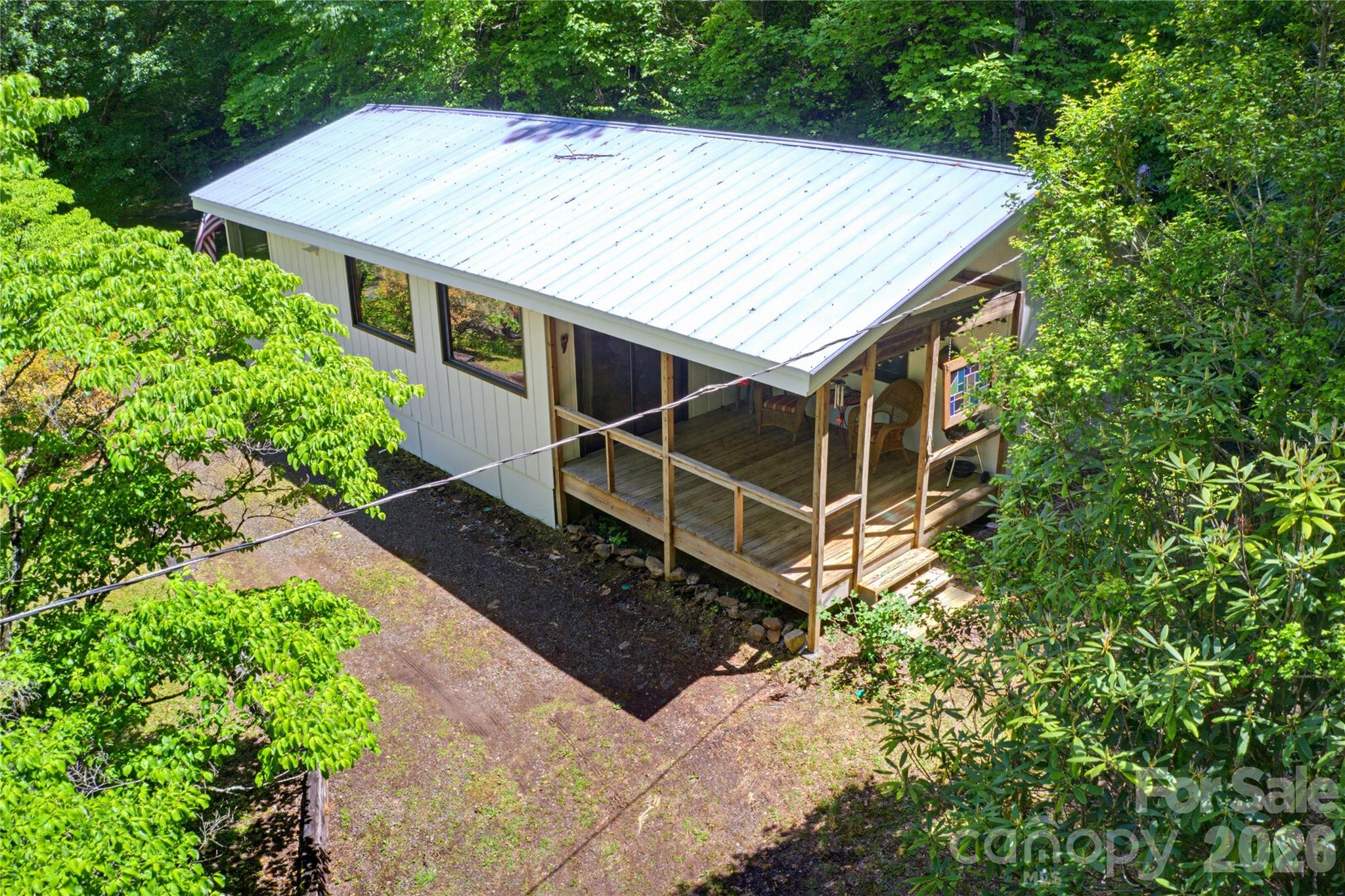 223 Little Cove Road Sylva, NC 28779 - Photo 1 of 31 an aerial view of a house with a yard and potted plants