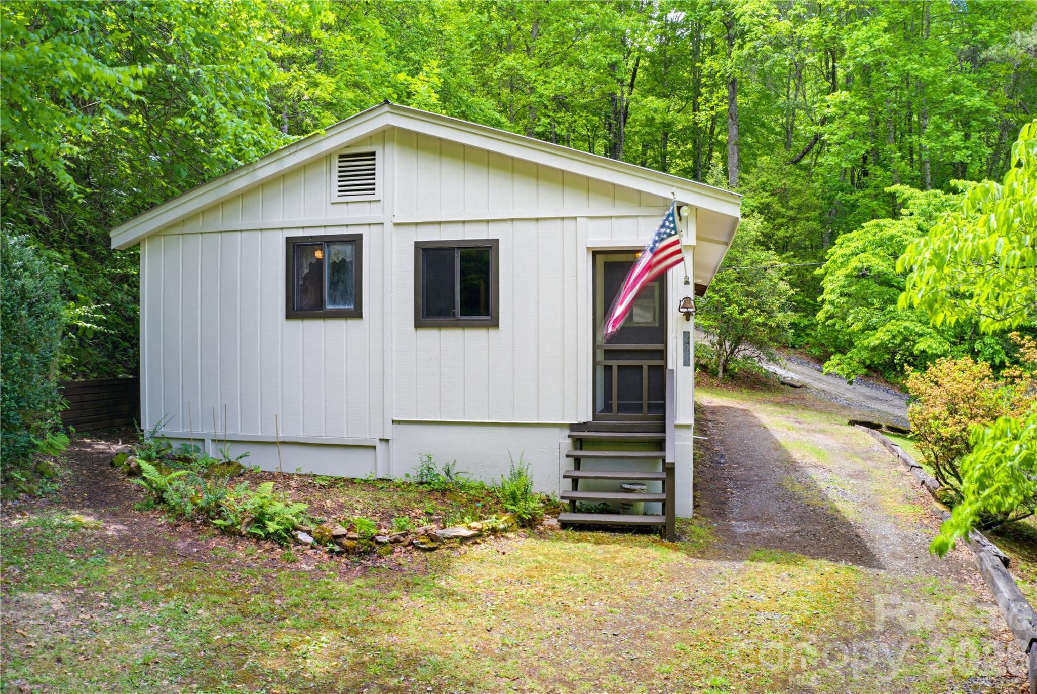 223 Little Cove Road Sylva, NC 28779 - Photo 11 of 31 a view of a small house with yard