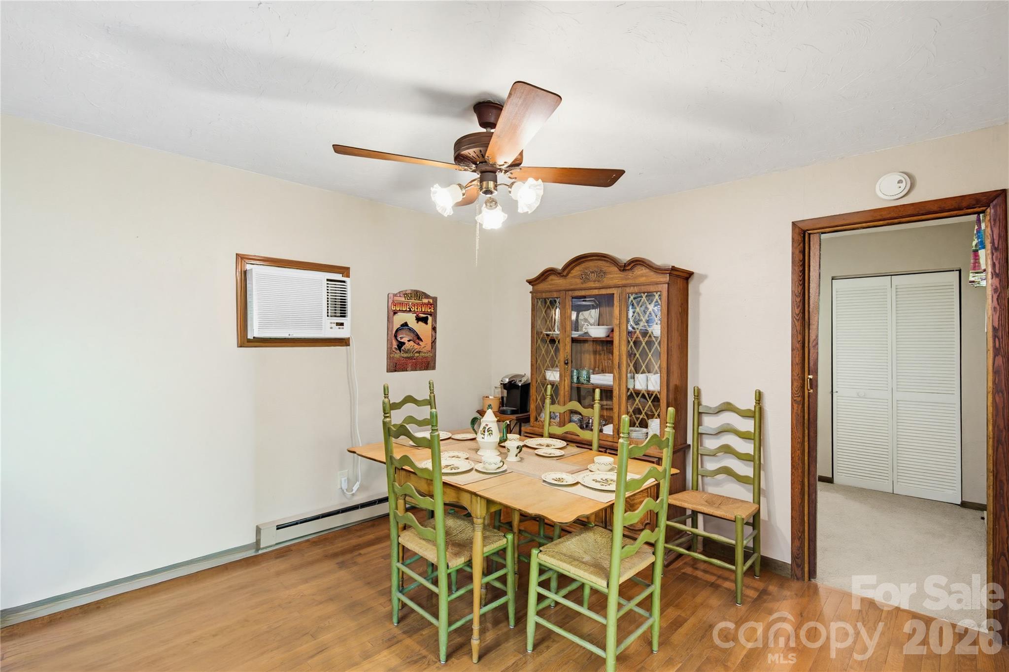 223 Little Cove Road Sylva, NC 28779 - Photo 25 of 31 a dining room with furniture and chandelier fan