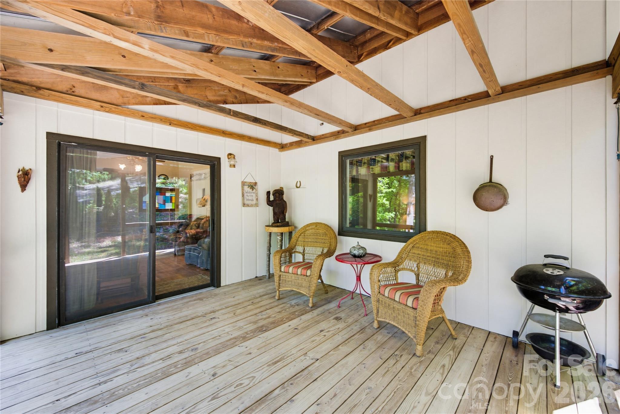 223 Little Cove Road Sylva, NC 28779 - Photo 31 of 31 a dining room with wooden floor and furniture