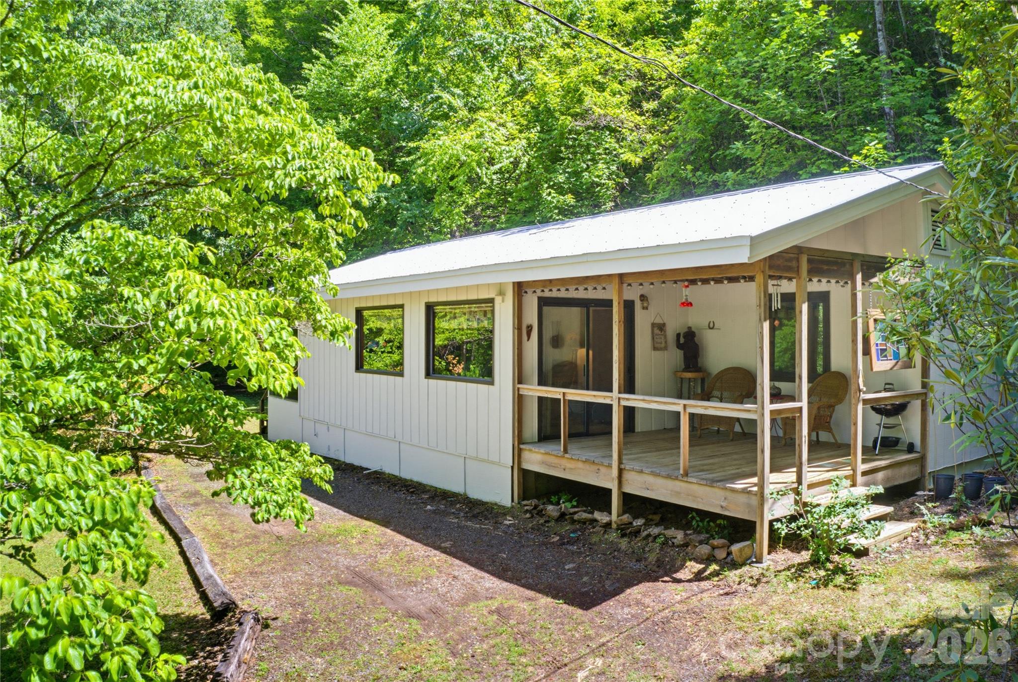223 Little Cove Road Sylva, NC 28779 - Photo 5 of 31 a house with trees in the background