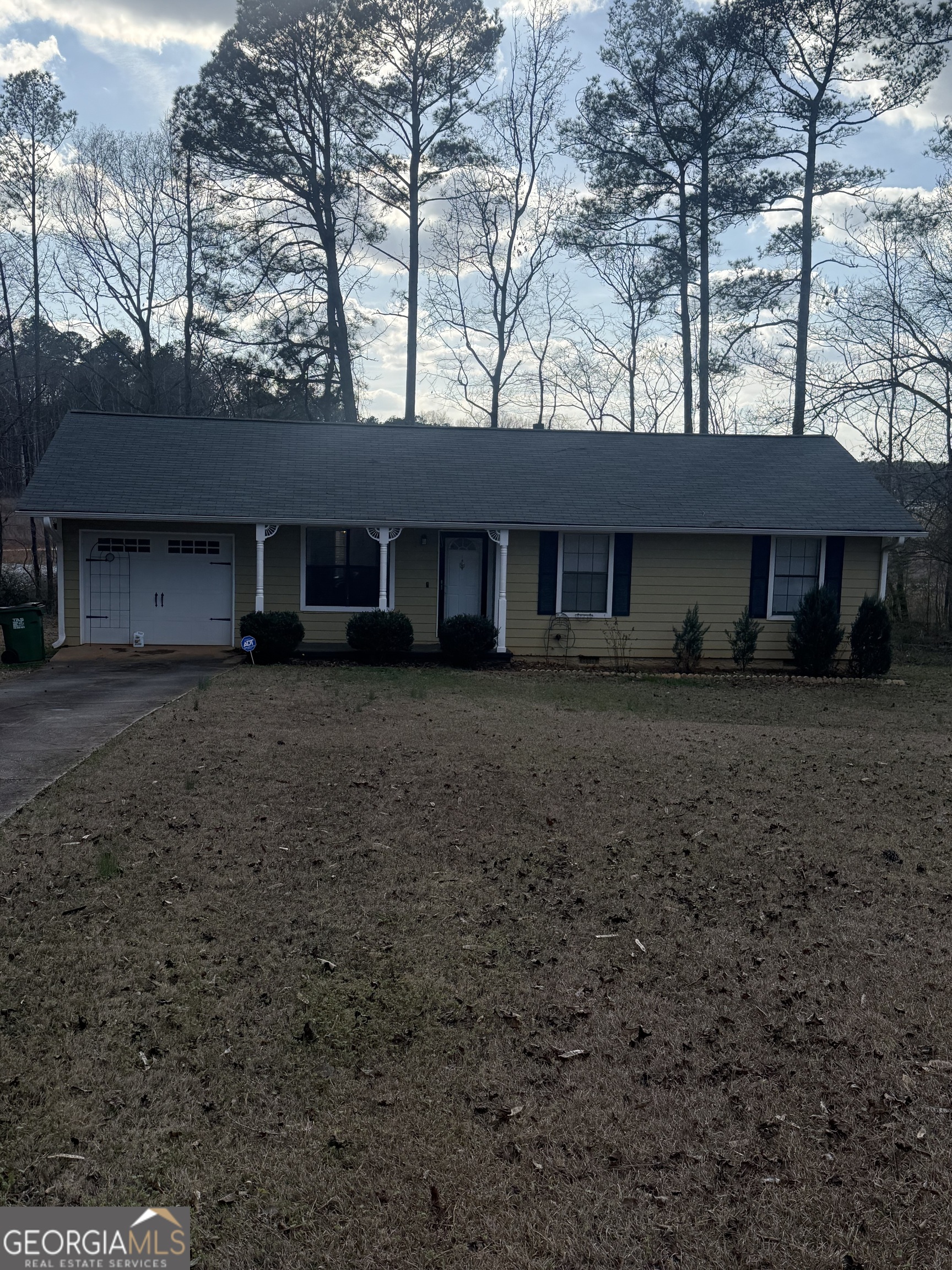 245 West James Circle Hampton, GA 30228 - Photo 14 of 14 a front view of a house with a yard