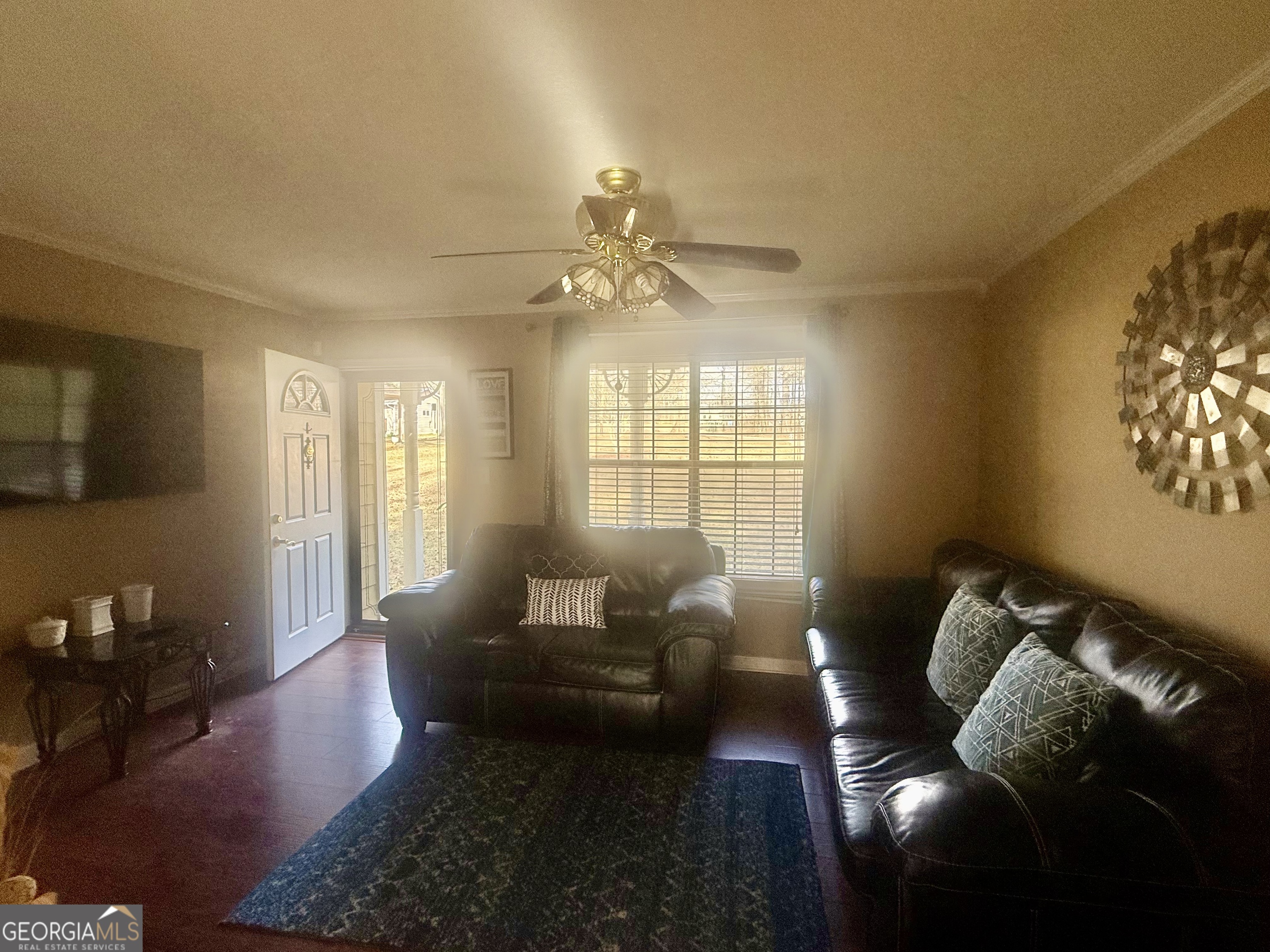 245 West James Circle Hampton, GA 30228 - Photo 2 of 14 a living room with furniture and a flat screen tv