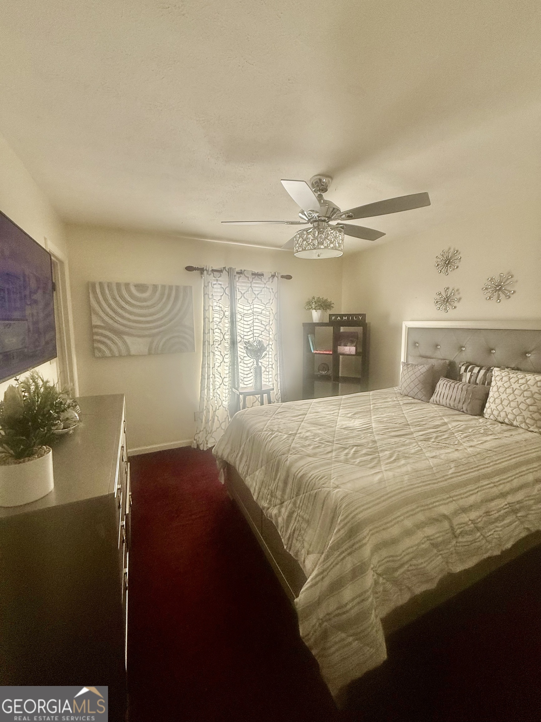 245 West James Circle Hampton, GA 30228 - Photo 7 of 14 a bedroom with a bed and a window