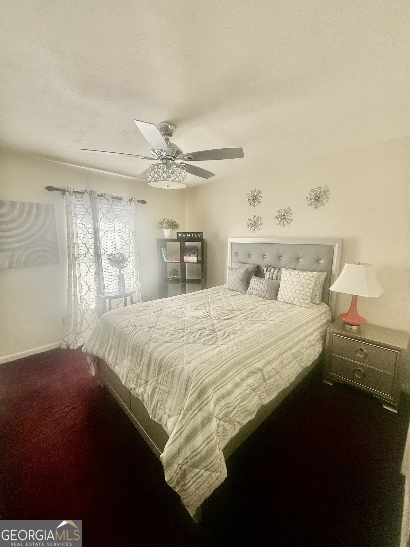 245 West James Circle Hampton, GA 30228 - Photo 8 of 14 a bedroom with a bed and a window