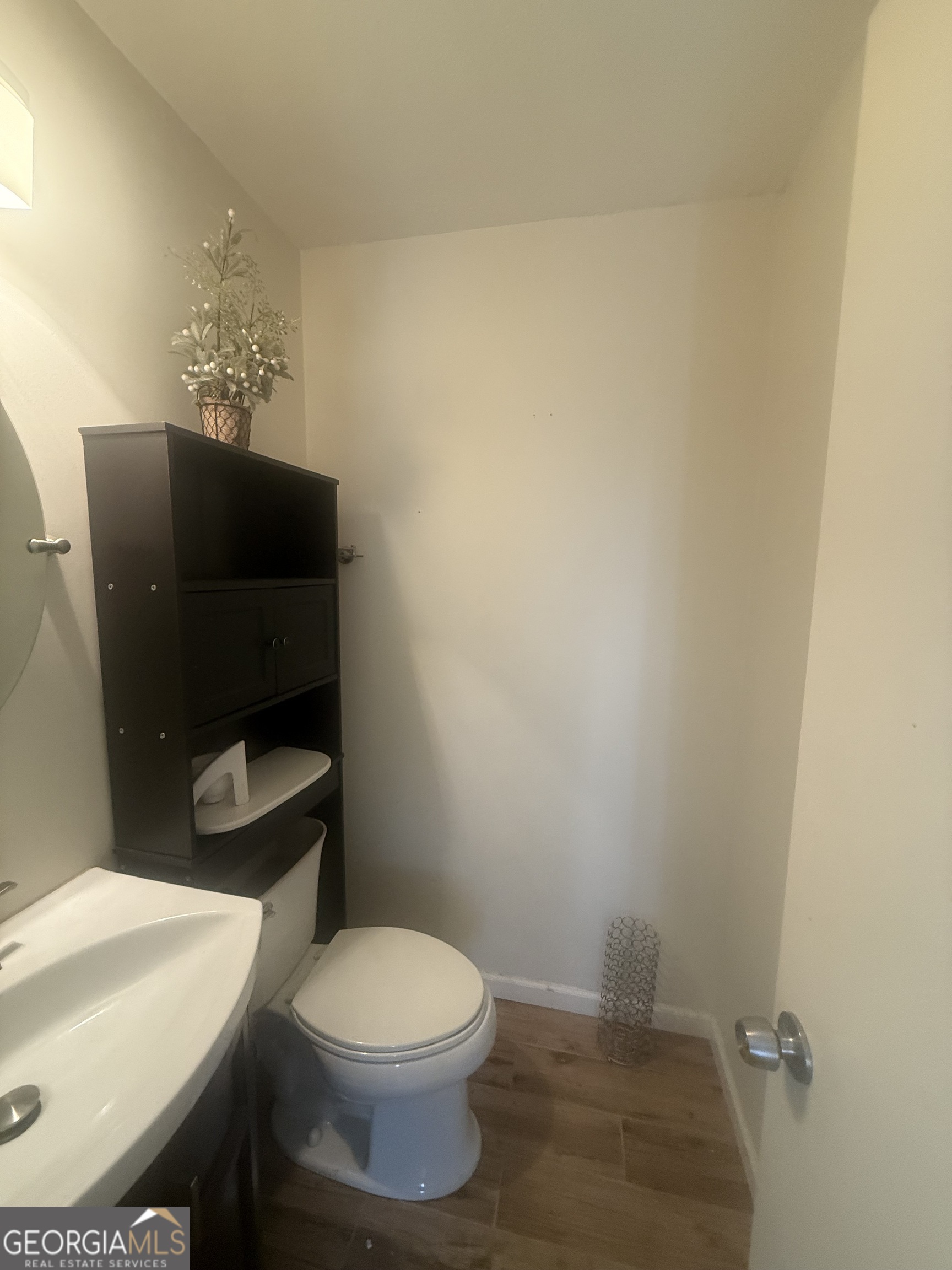 245 West James Circle Hampton, GA 30228 - Photo 9 of 14 a bathroom with a toilet and a sink