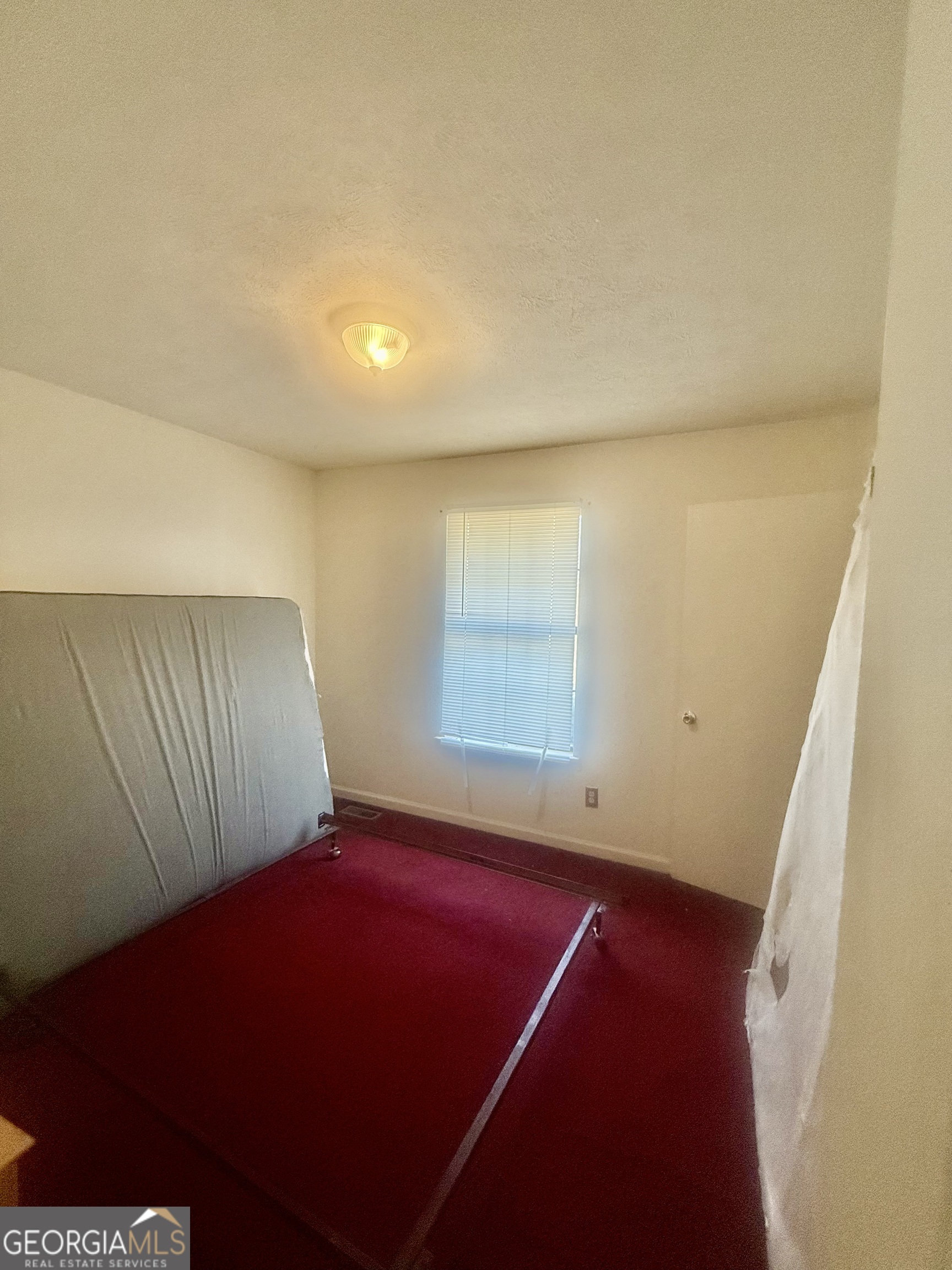 245 West James Circle Hampton, GA 30228 - Photo 10 of 14 a view of a room with windows