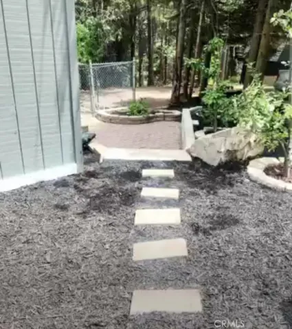 a view of a backyard with sitting area