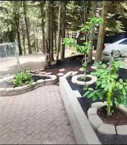 a backyard of a house with outdoor seating