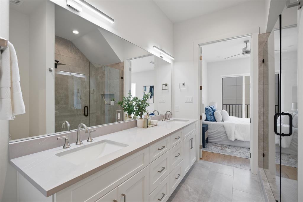 4517 Munger Avenue, Unit 101 Dallas, TX 75204 - Photo 16 of 39 a spacious bathroom with a double vanity sink mirror and