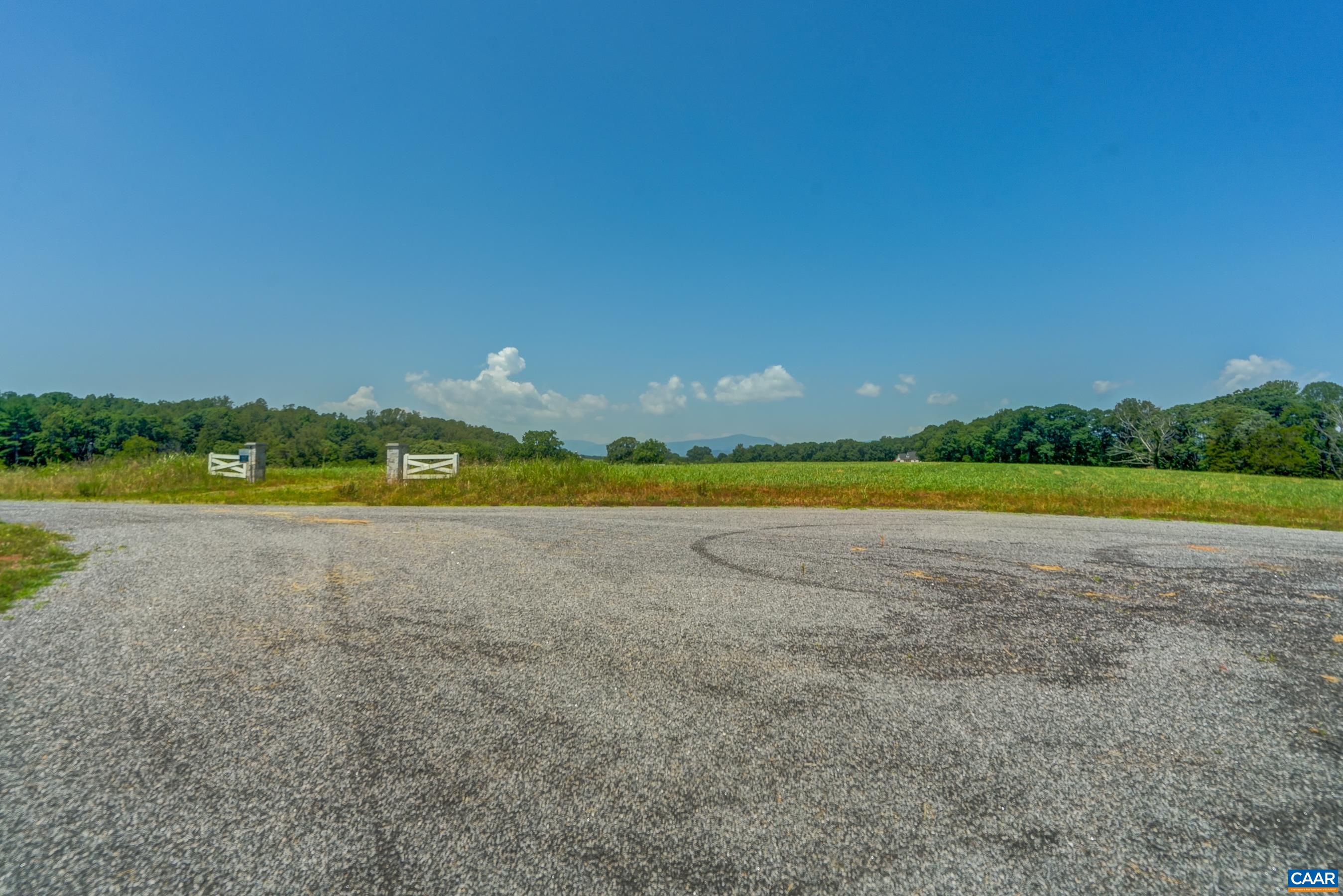 Lot 23 Sunset Ridge Ruckersville, VA 22968 - Photo 23 of 35 a view of a lake and a yard