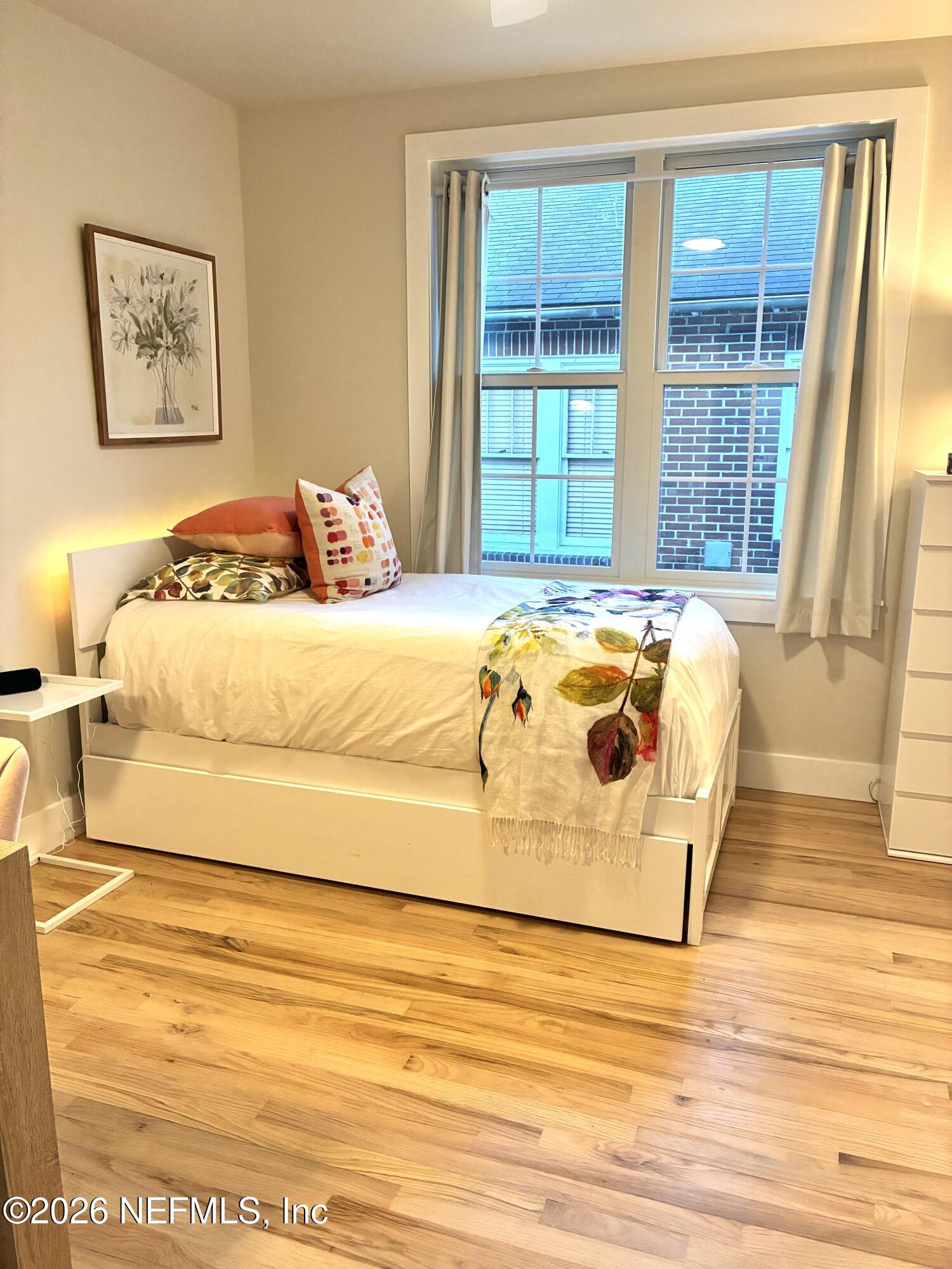 1011 Inwood Terrace Jacksonville, FL 32207 - Photo 21 of 56 a bedroom with a bed and a large window