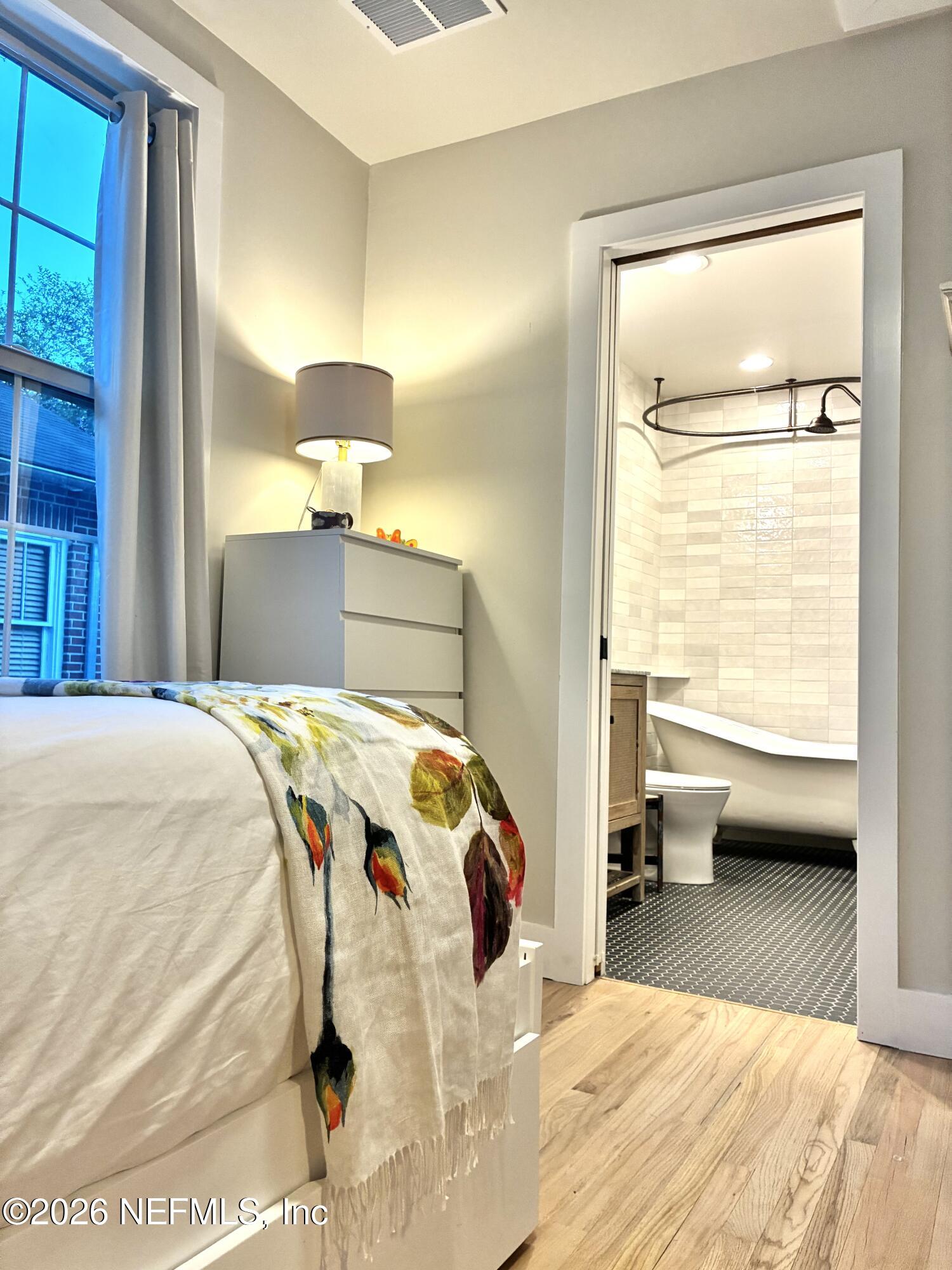 1011 Inwood Terrace Jacksonville, FL 32207 - Photo 23 of 56 a bedroom with a bed and a window