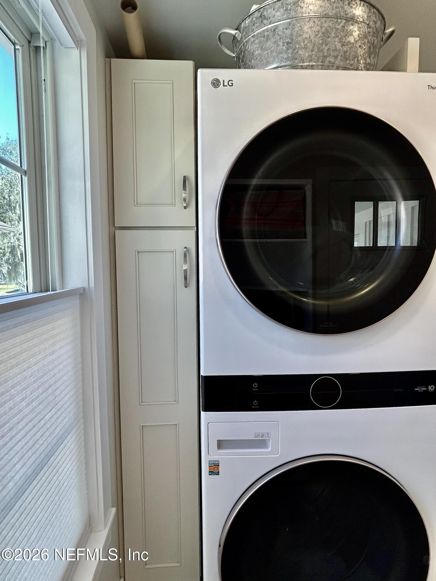 1011 Inwood Terrace Jacksonville, FL 32207 - Photo 28 of 56 a utility room with dryer and washer