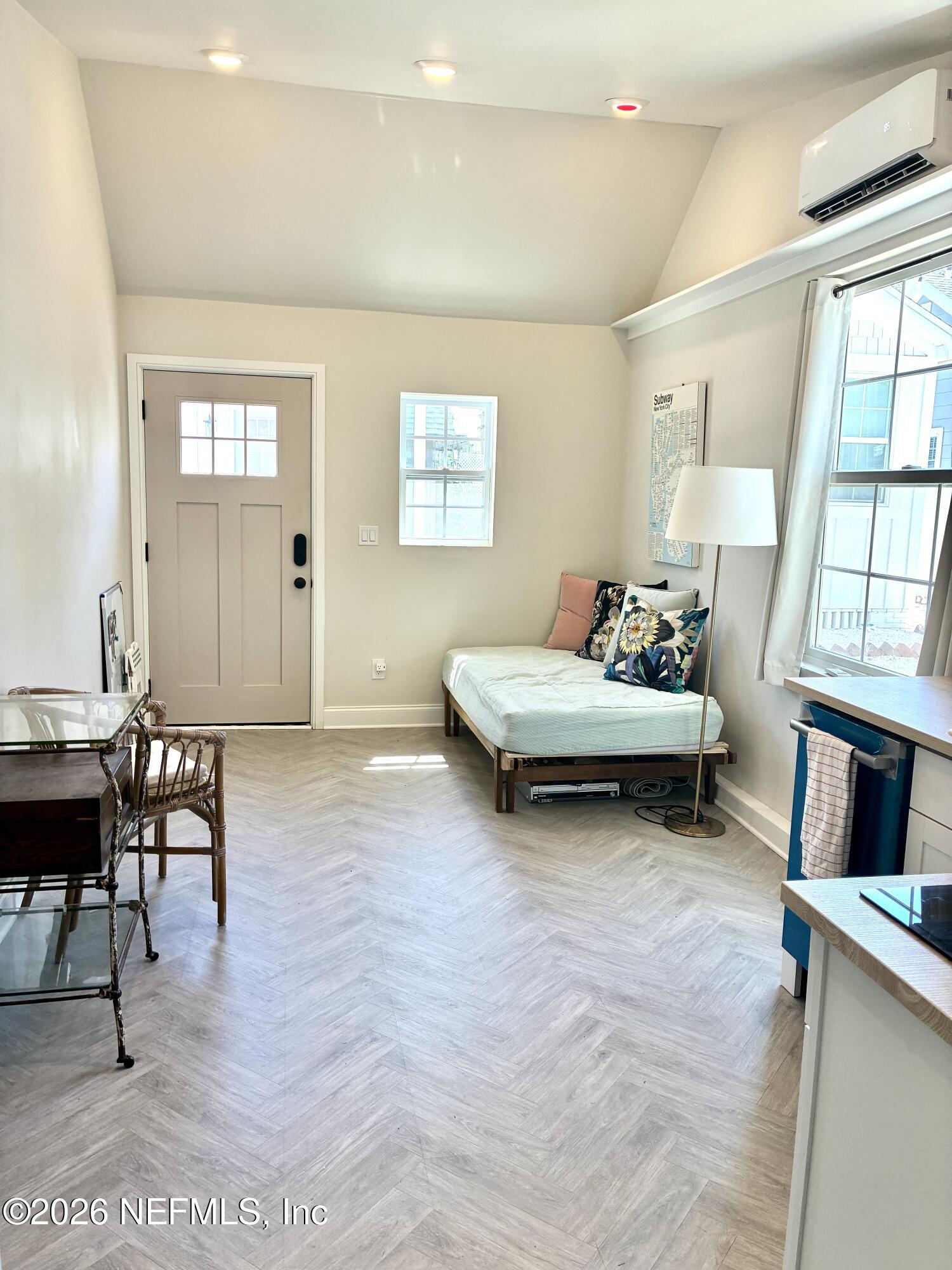 1011 Inwood Terrace Jacksonville, FL 32207 - Photo 31 of 56 a living room with furniture and a dining table next to a window
