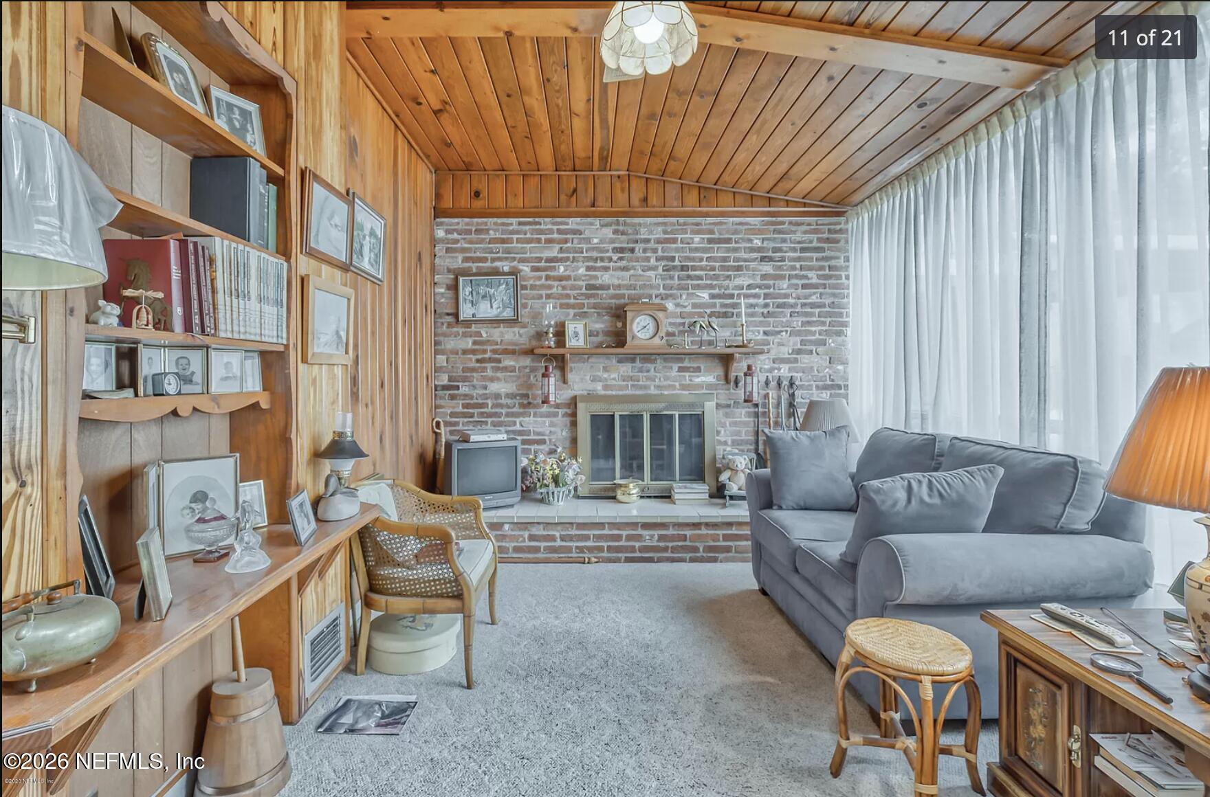 1011 Inwood Terrace Jacksonville, FL 32207 - Photo 47 of 56 a outdoor living space with patio furniture and a fireplace