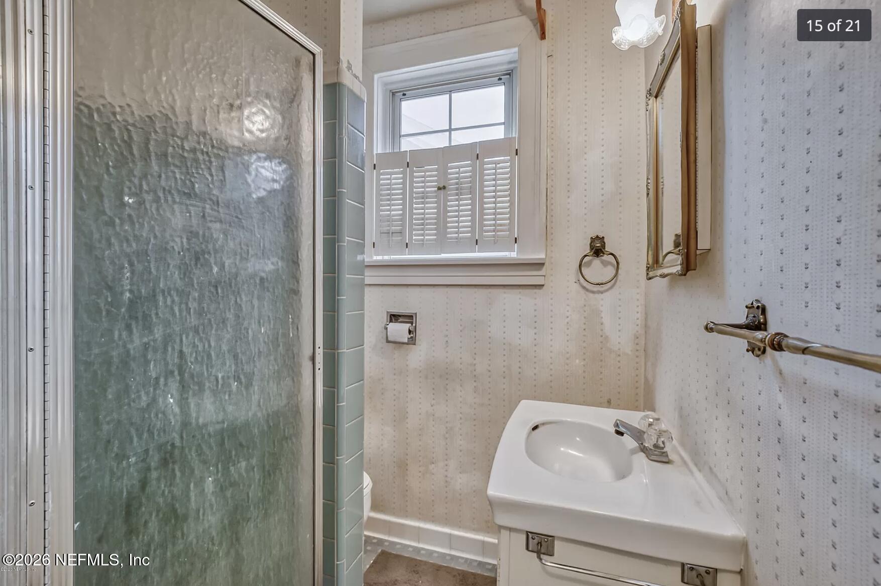 1011 Inwood Terrace Jacksonville, FL 32207 - Photo 54 of 56 a bathroom with a sink a toilet and a shower