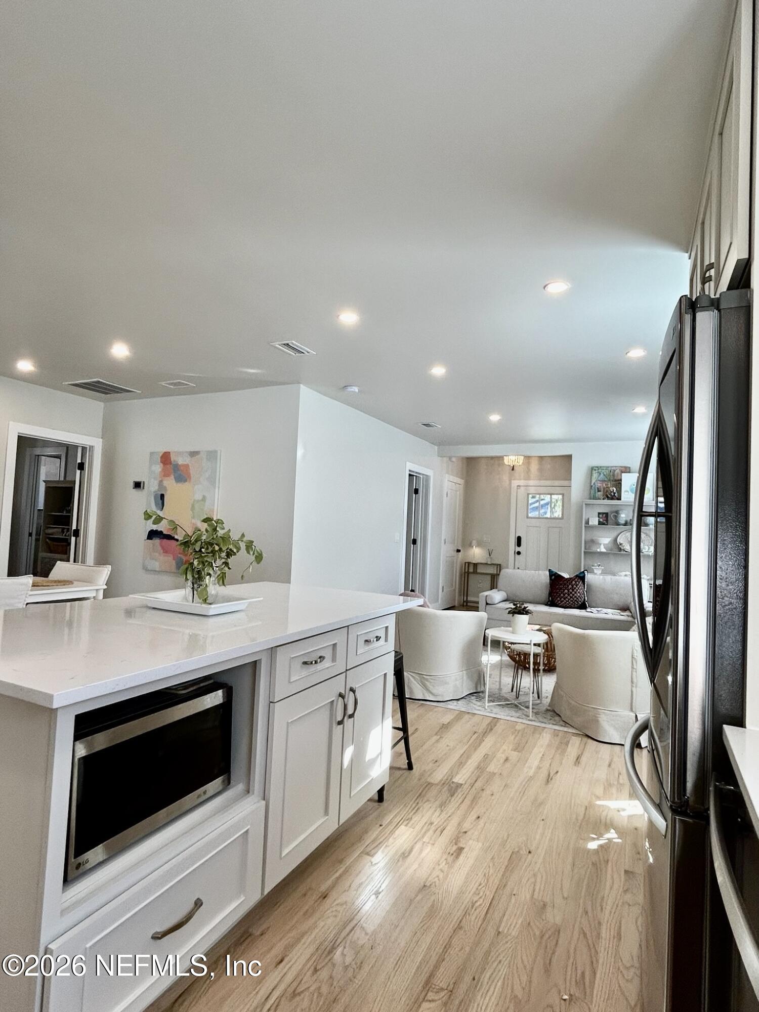 1011 Inwood Terrace Jacksonville, FL 32207 - Photo 9 of 56 a large white kitchen with stainless steel appliances granite countertop a stove a sink a refrigerator and a cabinets