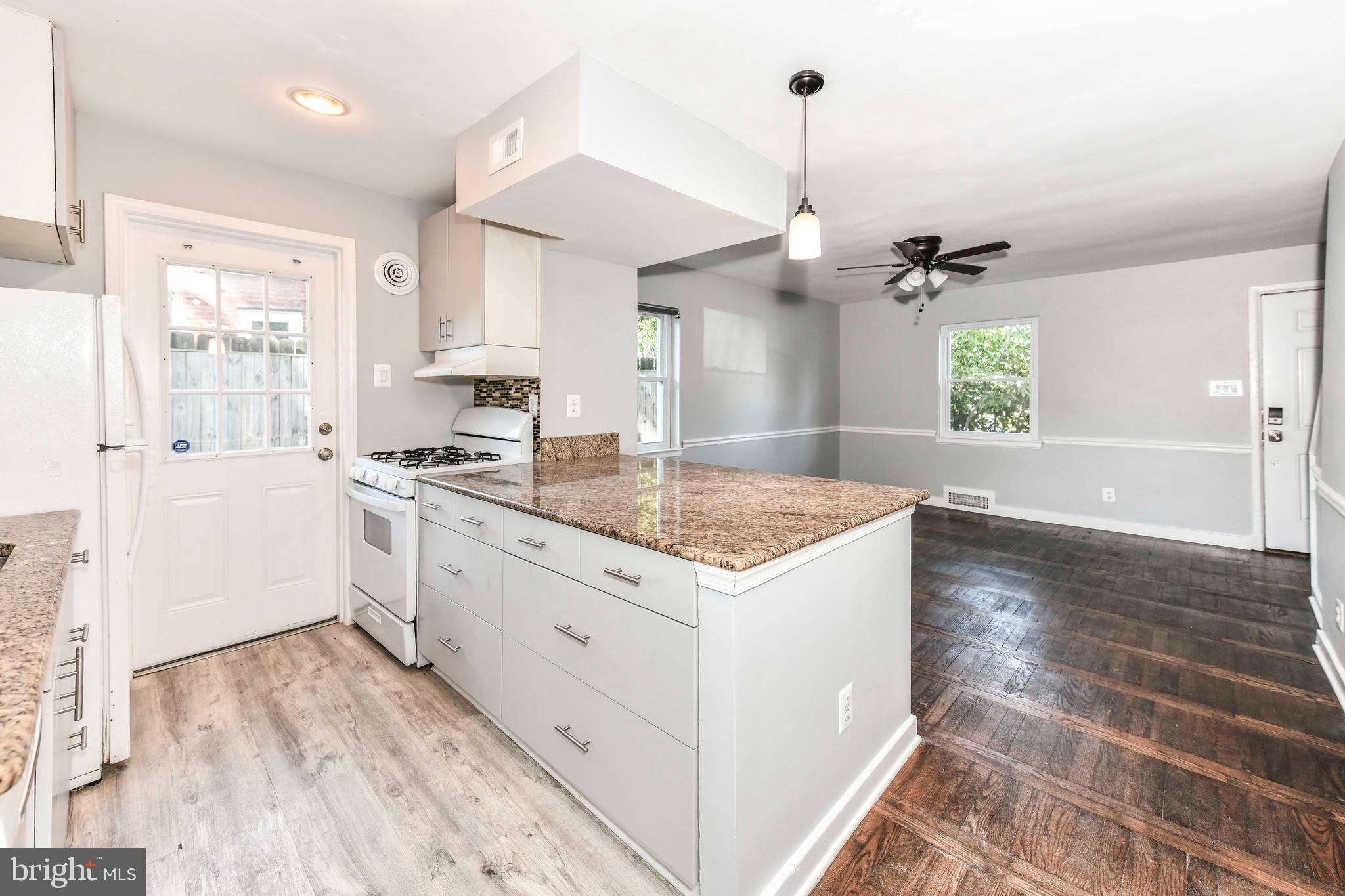 3210 9th Street South Arlington, VA 22204 - Photo 11 of 26 a kitchen that has a sink a stove and window