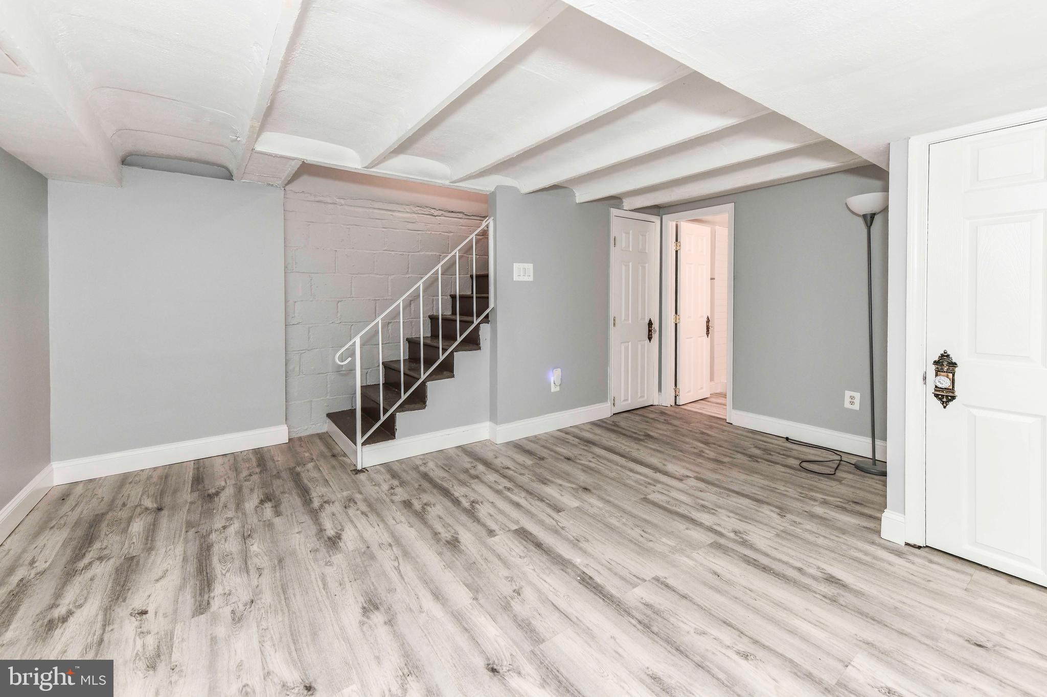 3210 9th Street South Arlington, VA 22204 - Photo 16 of 26 a view of a hallway with wooden floor and staircase