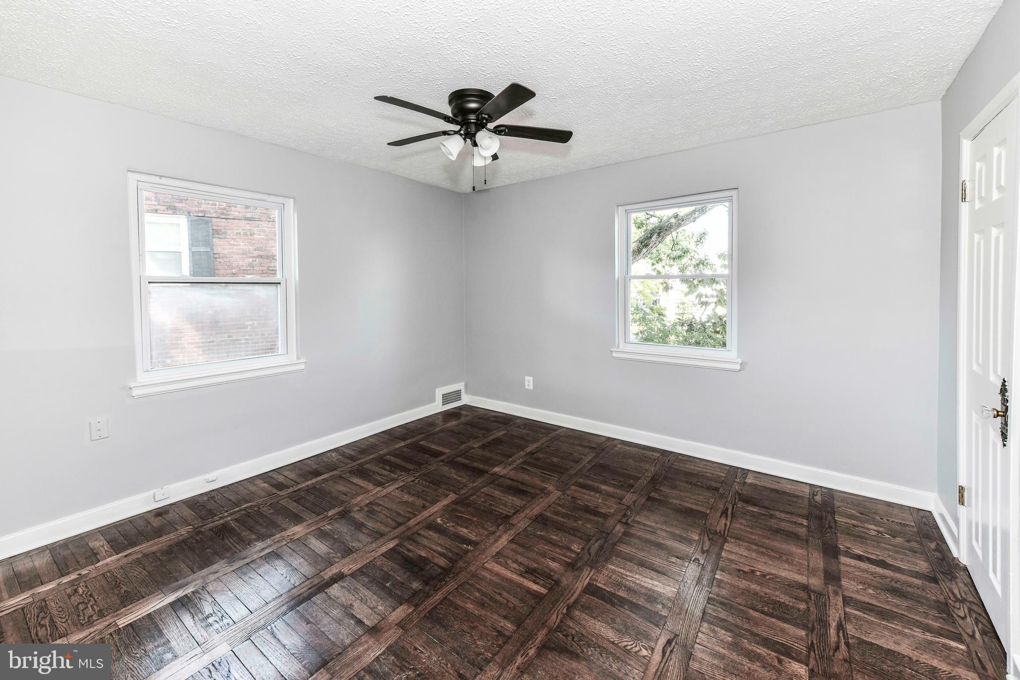 3210 9th Street South Arlington, VA 22204 - Photo 18 of 26 a view of a room with wooden floor and windows