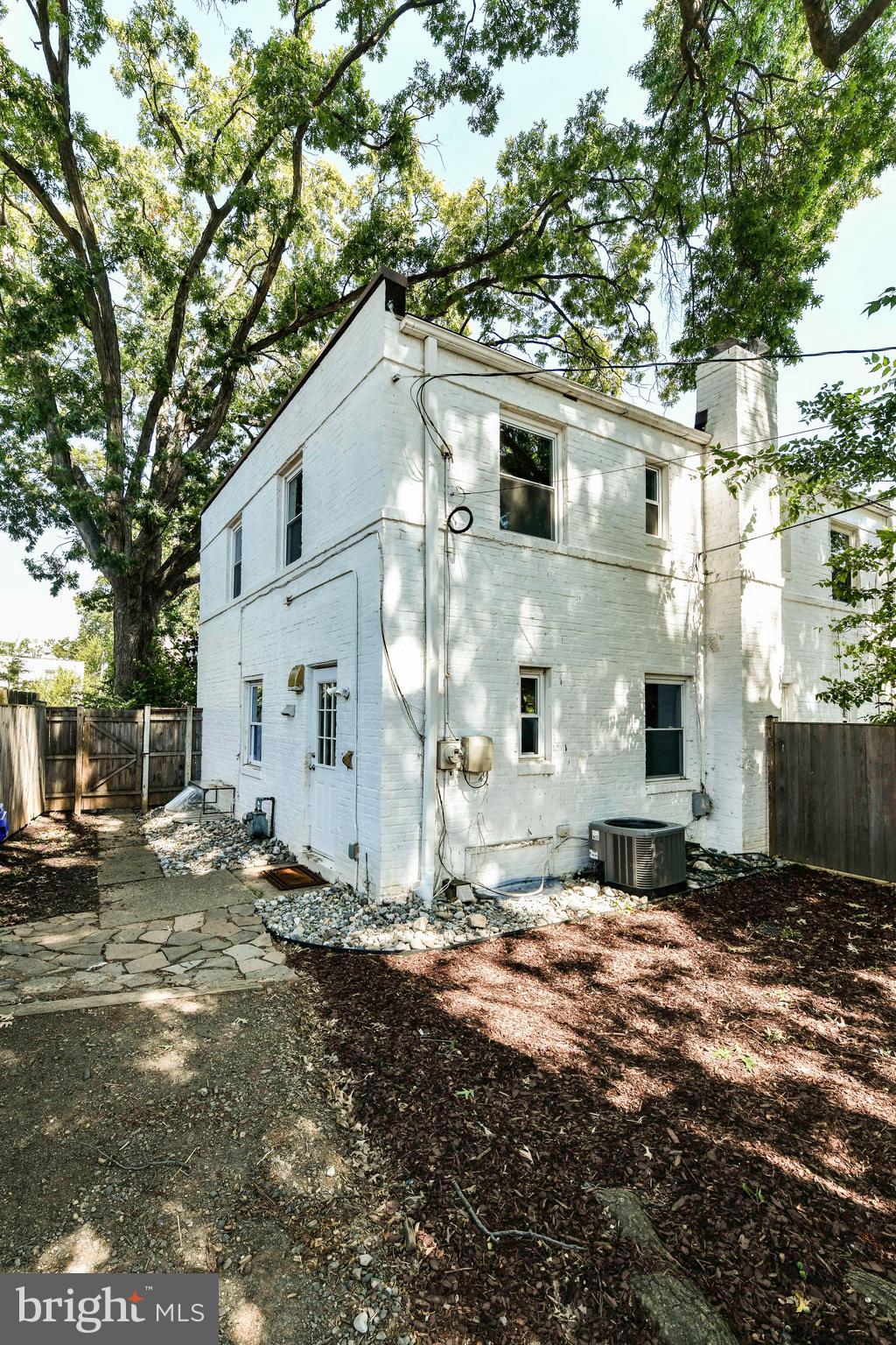 3210 9th Street South Arlington, VA 22204 - Photo 25 of 26 a view of a white house with a yard