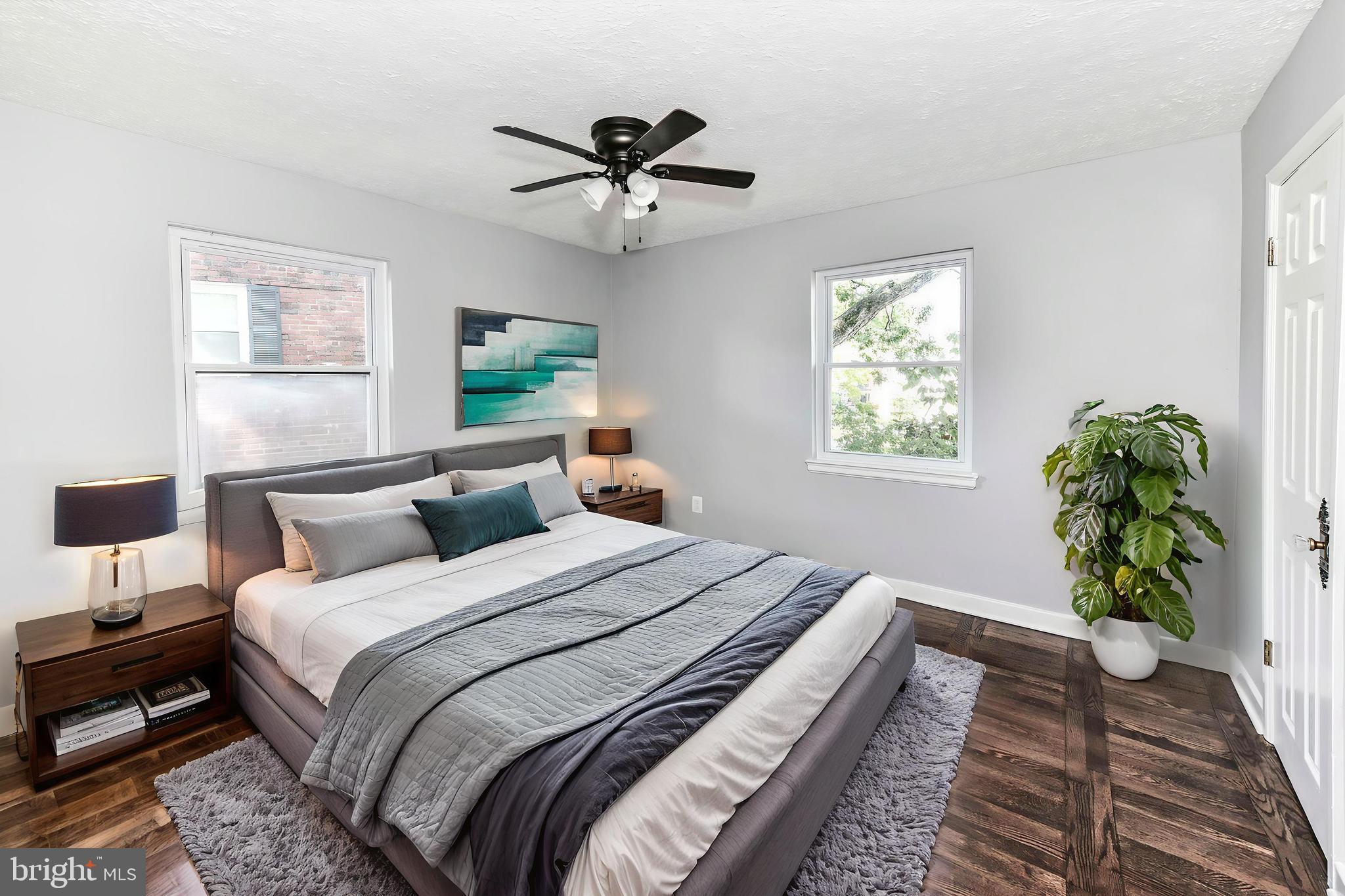 3210 9th Street South Arlington, VA 22204 - Photo 5 of 26 a bedroom with bed and a potted plant
