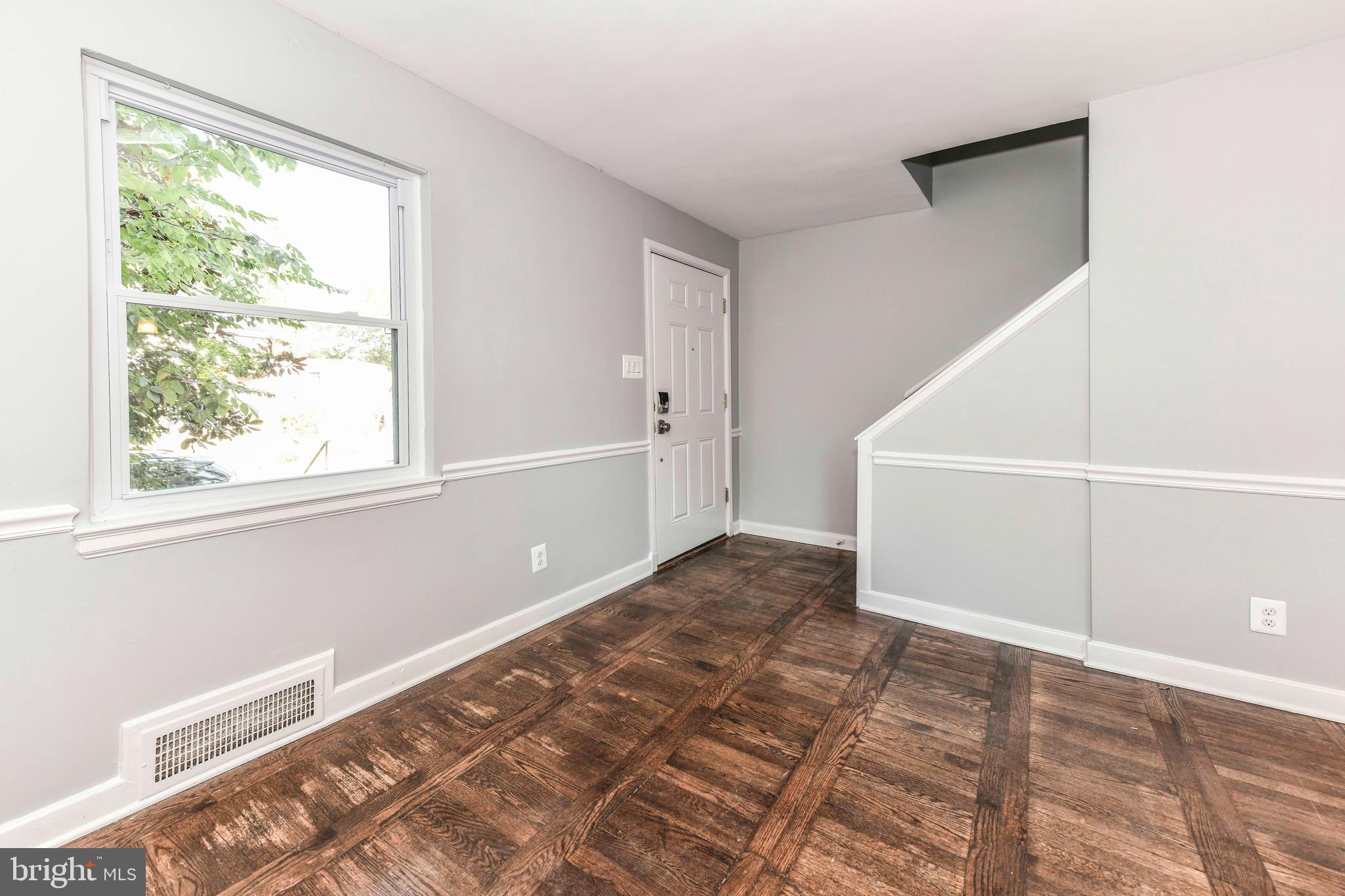 3210 9th Street South Arlington, VA 22204 - Photo 6 of 26 a view of a big room with wooden floor and windows