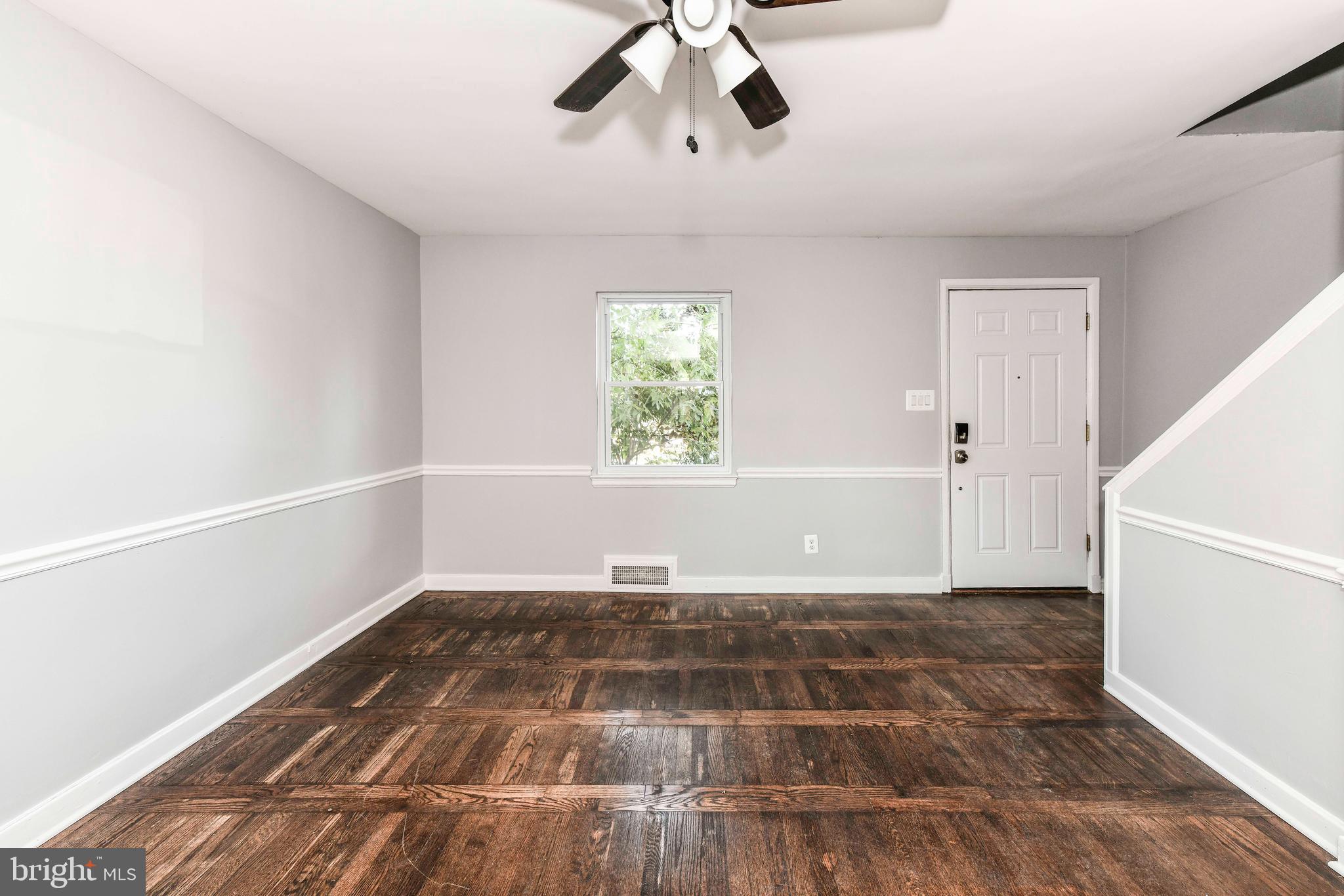 3210 9th Street South Arlington, VA 22204 - Photo 9 of 26 wooden floor in an empty room with a window