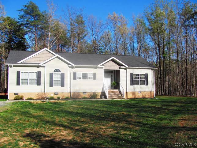 2862 Roundabout Road Louisa, VA 23093 - Photo 1 of 24 a front view of a house with a yard