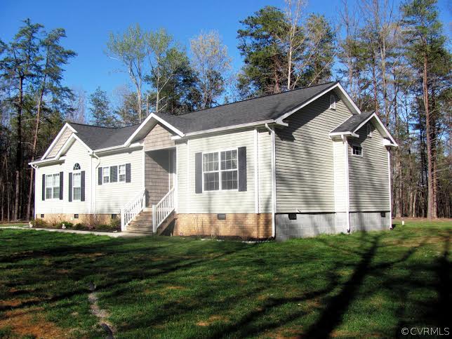 2862 Roundabout Road Louisa, VA 23093 - Photo 2 of 24 a front view of a house with a yard
