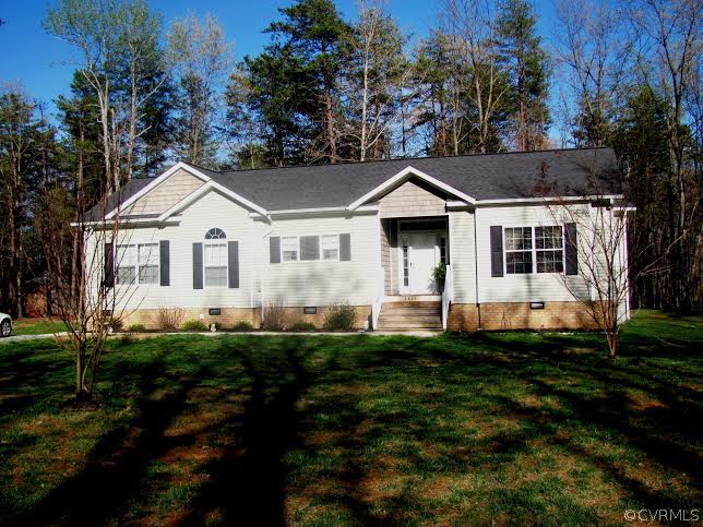 2862 Roundabout Road Louisa, VA 23093 - Photo 3 of 24 a front view of a house with a yard