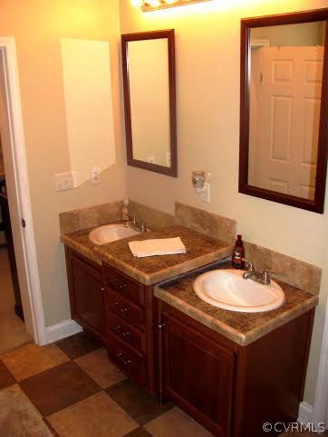2862 Roundabout Road Louisa, VA 23093 - Photo 8 of 24 a bathroom with a sink and a mirror
