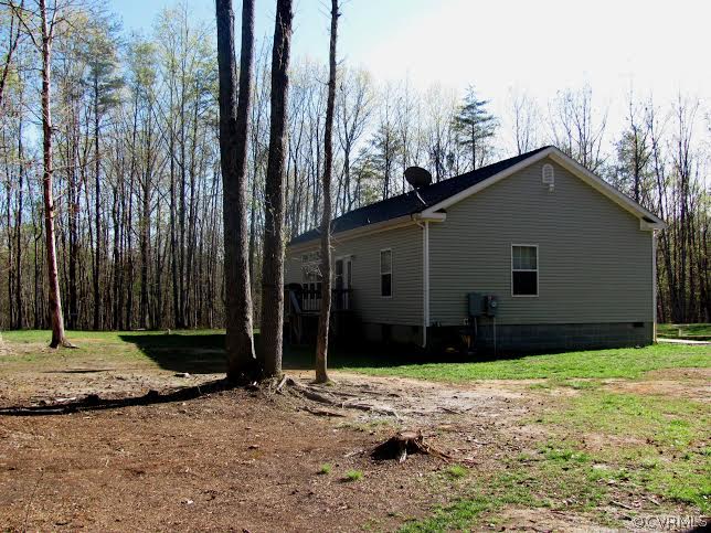 2862 Roundabout Road Louisa, VA 23093 - Photo 10 of 24 a house with trees in front of it