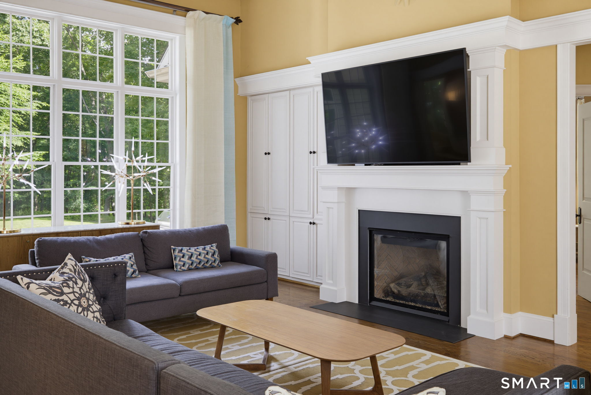 158 Appian Way Coventry, CT 06238 - Photo 13 of 40 a living room with furniture a flat screen tv and a fireplace