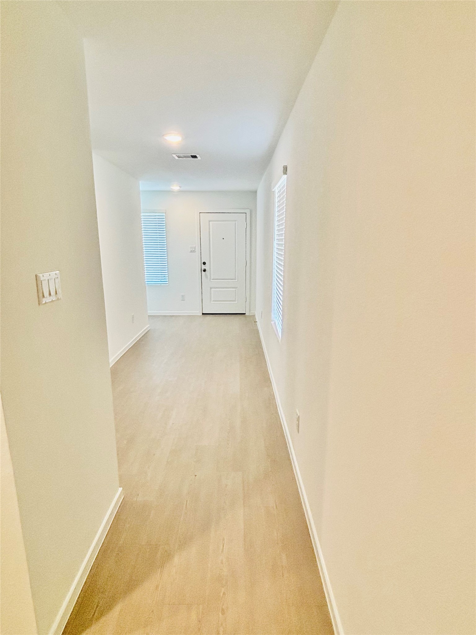 2126 Mosaic Vly Court Angleton, TX 77515 - Photo 6 of 40 a view of a hallway with wooden floor