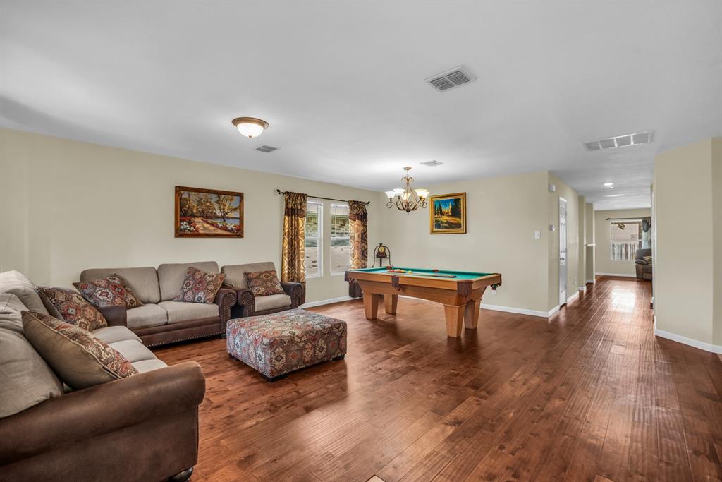 5718 Green Ivy Road Denton, TX 76210 - Photo 11 of 37 Spacious interior featuring wood-finish flooring, light-toned walls, and recessed lighting