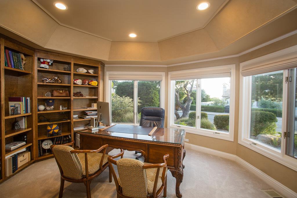 1003 Rodeo Road Pebble Beach, CA 93953 - Photo 17 of 24 a view of a workspace with furniture and a window
