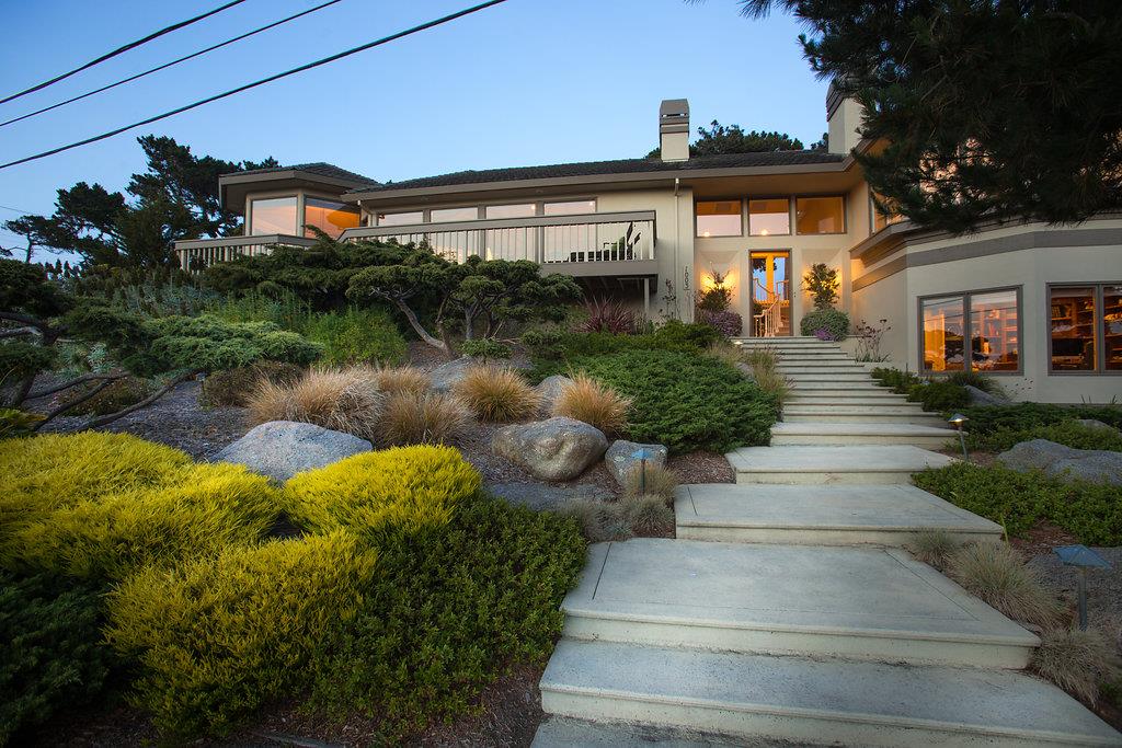1003 Rodeo Road Pebble Beach, CA 93953 - Photo 22 of 24 a front view of a house with garden