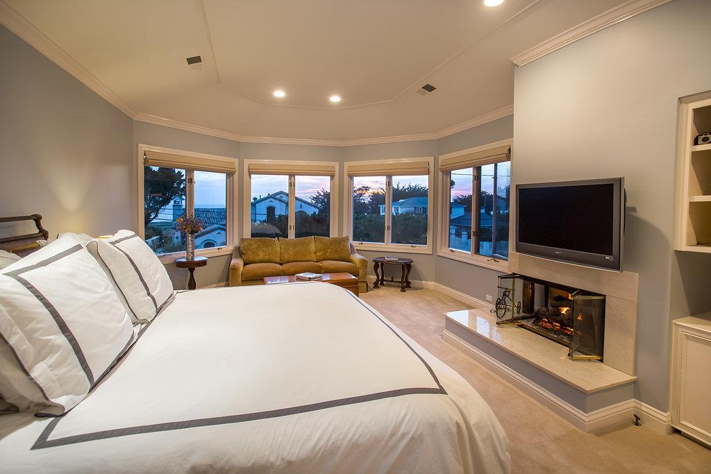 1003 Rodeo Road Pebble Beach, CA 93953 - Photo 8 of 24 a living room with furniture and a flat screen tv