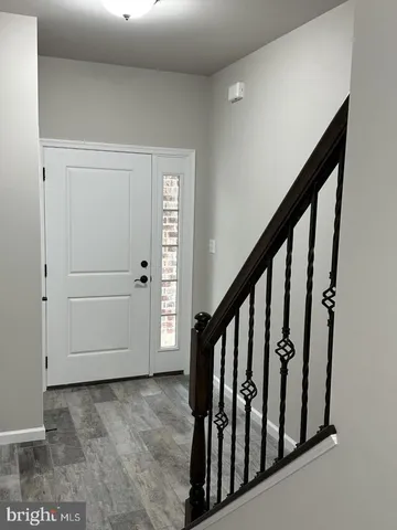 a view of staircase with white walls